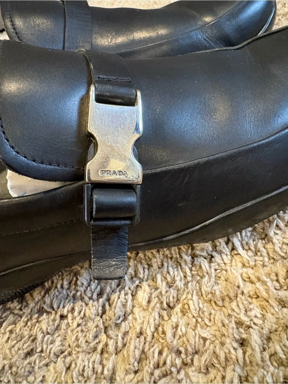 Prada Linea Rossa Black Leather Slip-On Loafers with Metal Buckle